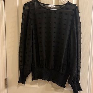 Black polka dot sheer blouse. Size medium.